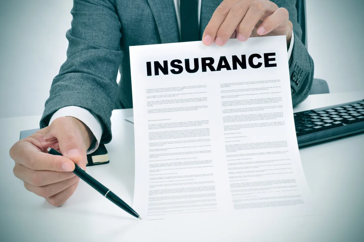 Insurance policy document presented for signing